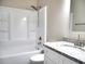 Bathroom featuring a shower and tub combination and a granite countertop with a sink and modern faucet at 104 Jessica Lakes Dr., Conway, SC 29526