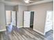 Bedroom with grey vinyl floors, multiple doors and natural lighting from several windows at 104 Jessica Lakes Dr., Conway, SC 29526
