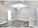 Elegant dining area featuring modern chandelier, neutral paint, and bright natural light at 104 Jessica Lakes Dr., Conway, SC 29526