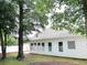 A white single-story home with well-maintained siding and several windows providing ample natural light at 104 Jessica Lakes Dr., Conway, SC 29526