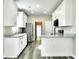Spacious kitchen with white cabinets, granite countertops, stainless steel appliances, and modern finishes at 104 Jessica Lakes Dr., Conway, SC 29526