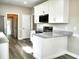 Kitchen area with white cabinets, granite counters, and stainless steel appliances, offering a sleek design at 104 Jessica Lakes Dr., Conway, SC 29526