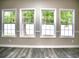 Bright living area with four large windows offering an abundance of natural light at 104 Jessica Lakes Dr., Conway, SC 29526