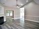 Open-concept living room with fireplace and natural light showcasing the inviting interior at 104 Jessica Lakes Dr., Conway, SC 29526