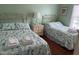 Comfortable bedroom featuring bright walls, natural light, and two twin beds at 112 B 12Th Ave. N, Surfside Beach, SC 29575