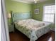 Comfortable bedroom featuring bright walls, natural light, and a patterned bedspread at 112 B 12Th Ave. N, Surfside Beach, SC 29575