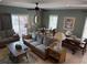 Comfortable living room area with couch, dining table, and access to outdoor patio at 112 B 12Th Ave. N, Surfside Beach, SC 29575