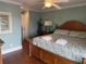 Cozy main bedroom with a wooden bed frame and ensuite bathroom access at 112 B 12Th Ave. N, Surfside Beach, SC 29575