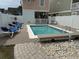 Well-maintained pool surrounded by a patio and lounge furniture at 112 B 12Th Ave. N, Surfside Beach, SC 29575