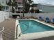 Private outdoor pool area with lounge chairs and hot tub at 112 B 12Th Ave. N, Surfside Beach, SC 29575