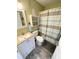 Bathroom features a white vanity, toilet, and a shower/tub with a striped shower curtain at 116 S Waccamaw Dr. # 205, Murrells Inlet, SC 29576