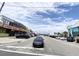 Street view of a road with cars, shops and a blue sky at 116 S Waccamaw Dr. # 205, Murrells Inlet, SC 29576
