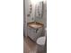 Bathroom featuring a granite countertop, sink, mirror, and nautical themed decorations at 1311 S Ocean Blvd. # B-1, North Myrtle Beach, SC 29582