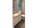 Bathroom featuring a vanity sink and a shower with a patterned curtain at 1311 S Ocean Blvd. # B-1, North Myrtle Beach, SC 29582