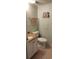 Bathroom with granite countertop, sink, toilet, and nautical themed decorations at 1311 S Ocean Blvd. # B-1, North Myrtle Beach, SC 29582