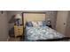 This cozy bedroom features a queen bed with attractive nautical themed bedding at 1311 S Ocean Blvd. # B-1, North Myrtle Beach, SC 29582