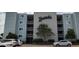 Xanadu condo building features a manicured landscape and reserved parking for residents at 1311 S Ocean Blvd. # B-1, North Myrtle Beach, SC 29582