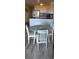 Dining area with seating for four is open to the kitchen, perfect for entertaining at 1311 S Ocean Blvd. # B-1, North Myrtle Beach, SC 29582