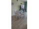 Bright dining area with seating for four and wood-look vinyl flooring at 1311 S Ocean Blvd. # B-1, North Myrtle Beach, SC 29582