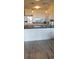 Bright kitchen featuring granite countertops, stainless steel appliances and wood laminate flooring at 1311 S Ocean Blvd. # B-1, North Myrtle Beach, SC 29582