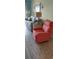 Relax in the comfortable living room featuring a plush recliner and beach-themed sofa at 1311 S Ocean Blvd. # B-1, North Myrtle Beach, SC 29582
