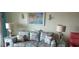 Cozy living room decorated in beach-themed decor featuring sofa and lamps at 1311 S Ocean Blvd. # B-1, North Myrtle Beach, SC 29582