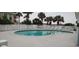 Inviting community pool surrounded by palm trees, creating a perfect outdoor relaxation area at 1311 S Ocean Blvd. # B-1, North Myrtle Beach, SC 29582