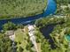 Expansive waterfront property featuring lush landscapes and a private boat dock at 134 Mohican Dr., Georgetown, SC 29440