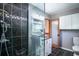 Modern bathroom with dark tiled shower, granite vanity, and decorative accents at 134 Mohican Dr., Georgetown, SC 29440