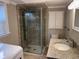 Bright bathroom features a glass-enclosed shower, granite vanity, and tiled floors at 134 Mohican Dr., Georgetown, SC 29440