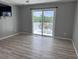 Bedroom featuring wood floors, sliding glass doors leading to a deck, and a ceiling fan at 134 Mohican Dr., Georgetown, SC 29440