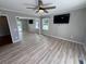 Bright bedroom with light wood floors, neutral grey walls, and a ceiling fan at 134 Mohican Dr., Georgetown, SC 29440