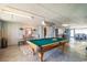 Spacious game room featuring a pool table, seating area, and bar, perfect for entertaining at 134 Mohican Dr., Georgetown, SC 29440