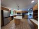Bright kitchen with stainless appliances, custom cabinets, a kitchen island, and a breakfast bar at 134 Mohican Dr., Georgetown, SC 29440