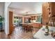 Open-concept kitchen with center island, seating, and warm wood cabinetry at 134 Mohican Dr., Georgetown, SC 29440
