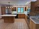 Updated kitchen features custom cabinets, stainless steel appliances, and a center island at 134 Mohican Dr., Georgetown, SC 29440