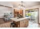Inviting kitchen with open layout, a center island and a sunroom just beyond at 134 Mohican Dr., Georgetown, SC 29440