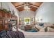 Spacious living room with vaulted ceilings, wood paneling and many windows for tons of natural light at 134 Mohican Dr., Georgetown, SC 29440