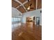 Spacious living room with hardwood floors, vaulted ceilings, and access to a sunroom and kitchen at 134 Mohican Dr., Georgetown, SC 29440