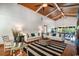 Bright living room with high ceilings, a ceiling fan, hardwood floors, and plush seating at 134 Mohican Dr., Georgetown, SC 29440
