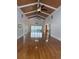 Open-concept living room featuring hardwood floors, vaulted ceilings and access to the sunroom at 134 Mohican Dr., Georgetown, SC 29440
