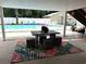 Relaxing outdoor patio with dining and seating area overlooking a sparkling pool at 134 Mohican Dr., Georgetown, SC 29440