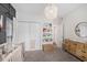 Charming Bedroom featuring a crib, changing table, and organized bookshelves at 1379 Cottage Dr., Myrtle Beach, SC 29577