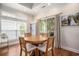 Cozy dining area featuring a round wooden table and lots of natural light at 1379 Cottage Dr., Myrtle Beach, SC 29577