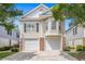 Welcoming two-story home with a two-car garage and brick accents on the lower level at 1379 Cottage Dr., Myrtle Beach, SC 29577