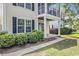 Charming home with a porch, well-manicured landscaping, and dark shutters at 1379 Cottage Dr., Myrtle Beach, SC 29577