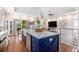 Open concept kitchen with island seating and views into living area at 1379 Cottage Dr., Myrtle Beach, SC 29577