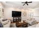 Living room featuring a vaulted ceiling, entertainment center, and a cozy seating area at 1379 Cottage Dr., Myrtle Beach, SC 29577