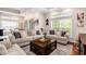 Bright living room with large windows and neutral furniture, offering a cozy and inviting space at 1379 Cottage Dr., Myrtle Beach, SC 29577