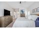 Large primary bedroom with an ensuite bath, TV, and natural light at 1379 Cottage Dr., Myrtle Beach, SC 29577